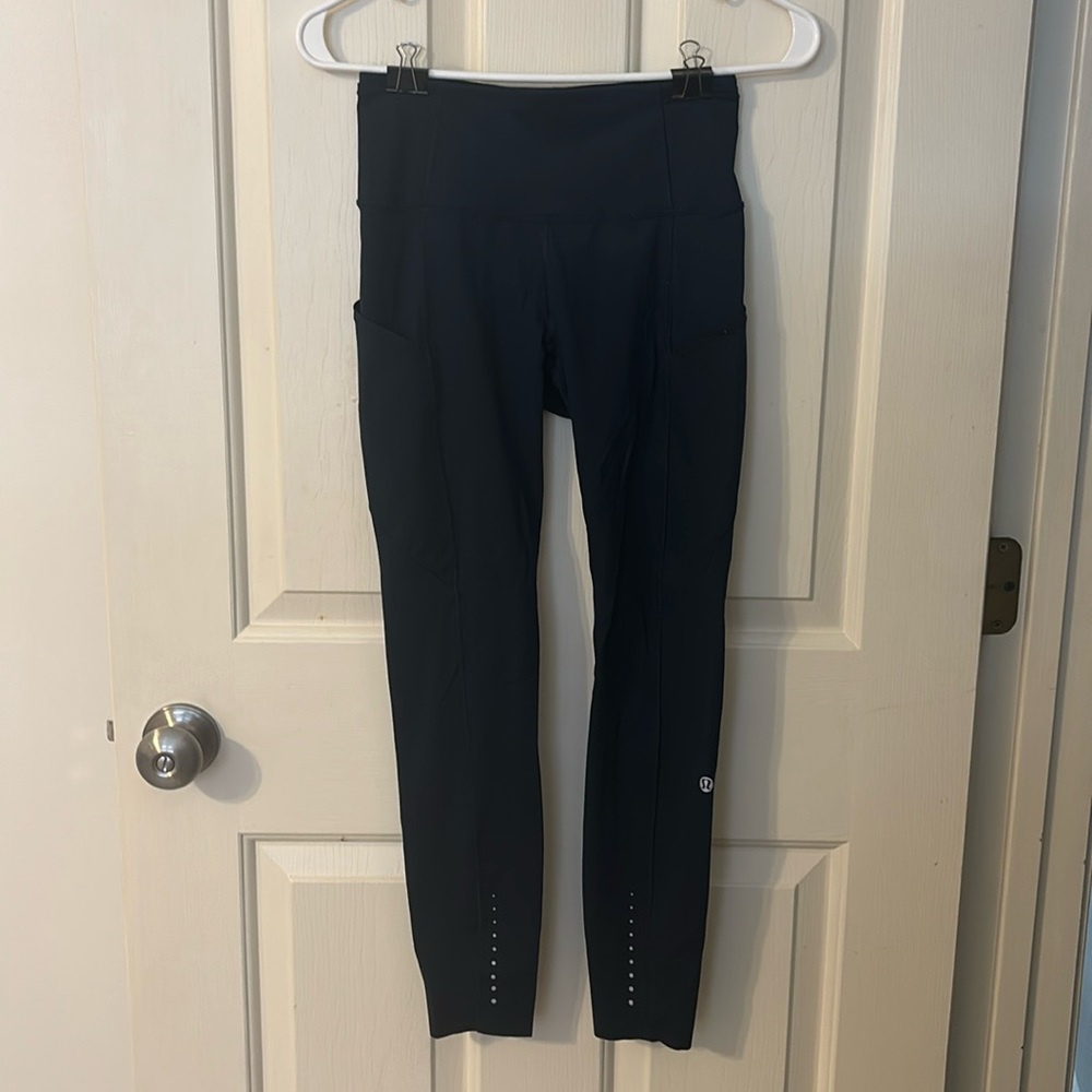 These are navy blue lululemon leggings. Never been worn.